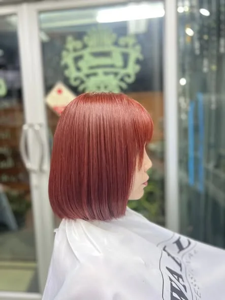 Vibrant Red Hair Color at Oilly Hair Salon Bangkok