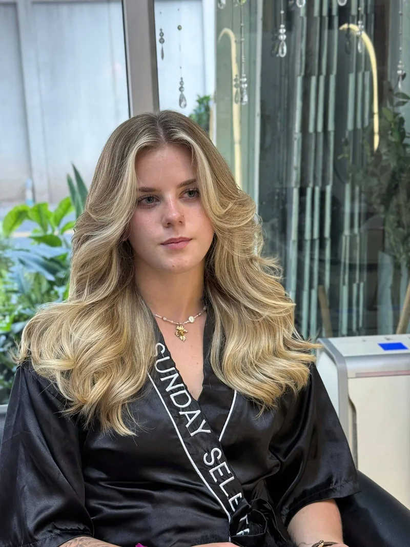 After highlights at Oilly Hair Salon Bangkok - dimensional blonde highlights with soft waves
