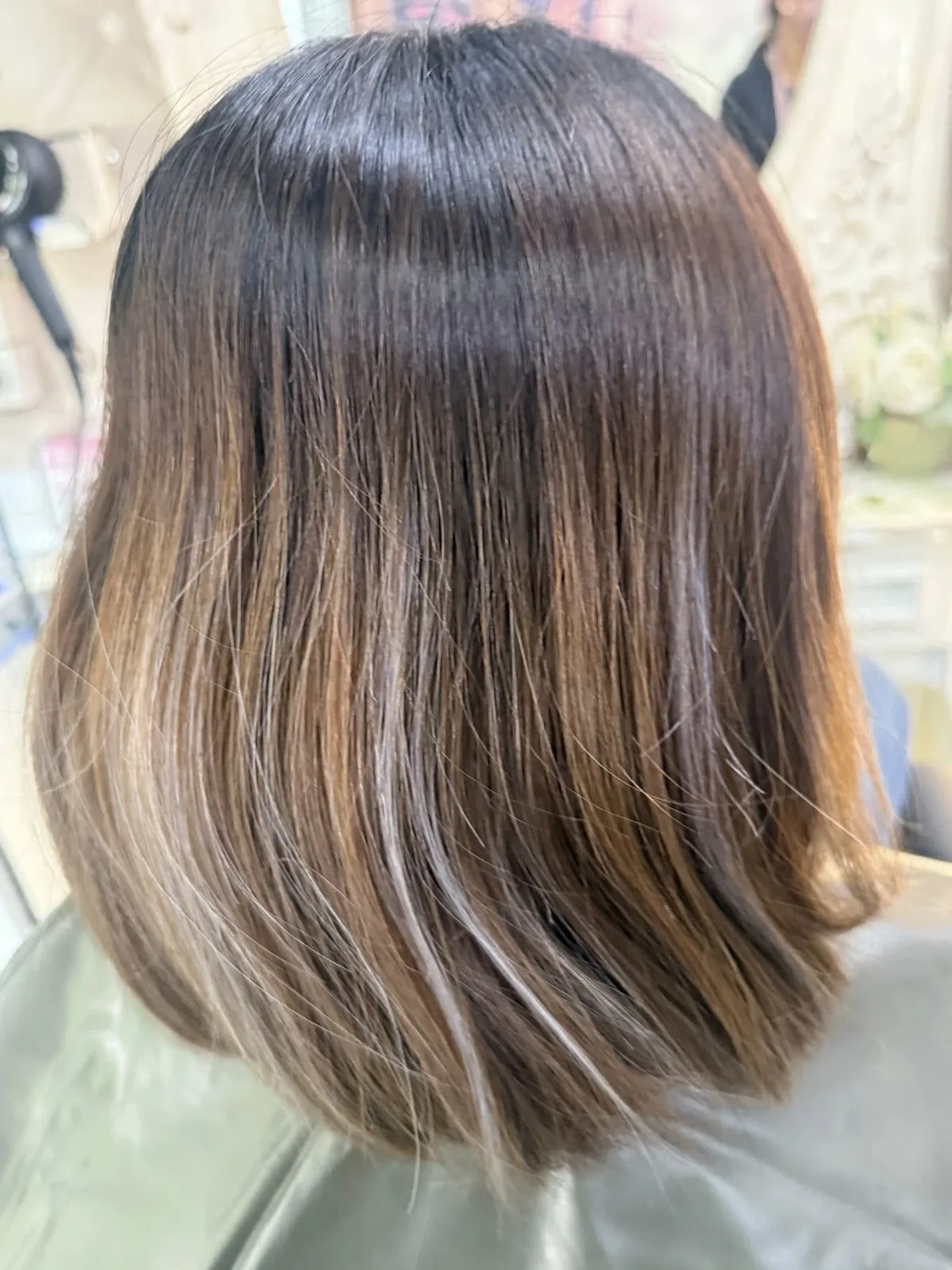 Smooth bob with soft balayage highlights at Oilly Hair Salon Bangkok