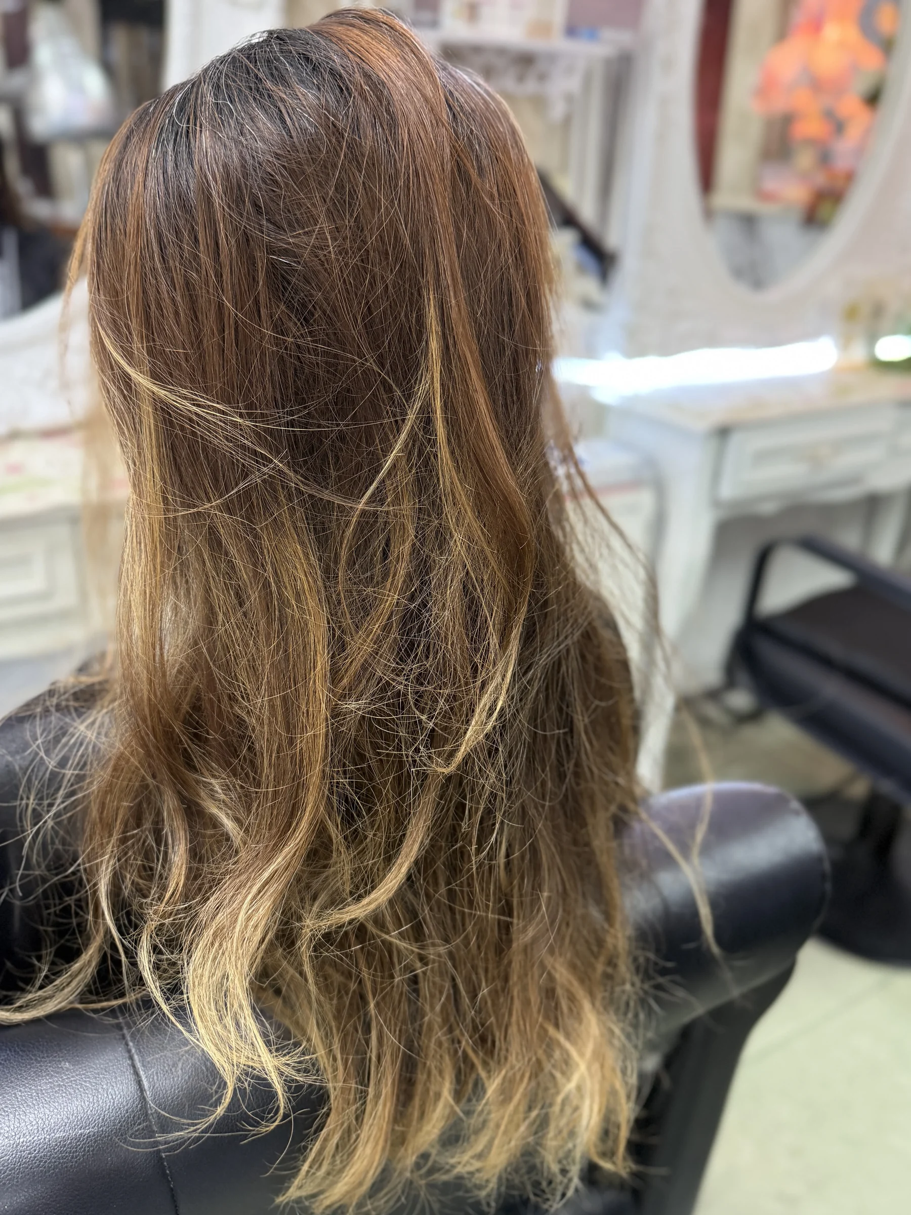 Hair condition, base color, and previous color history are checked before bleach placement.