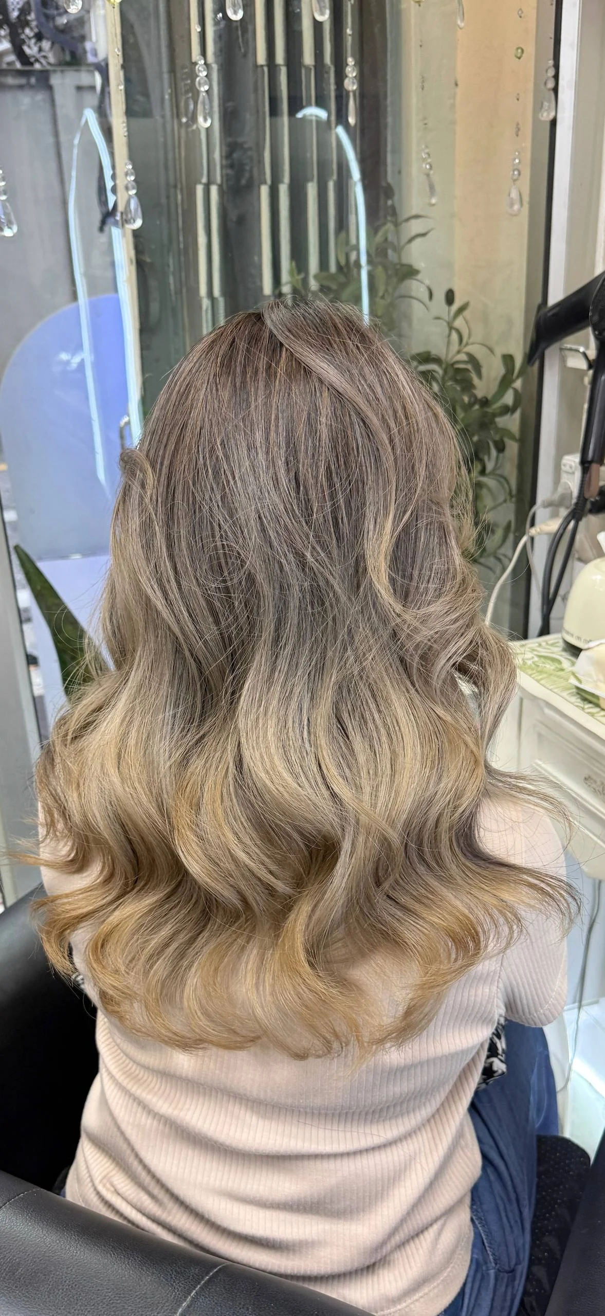 Creamy beige blonde balayage with soft root blend and grey blending result in Bangkok