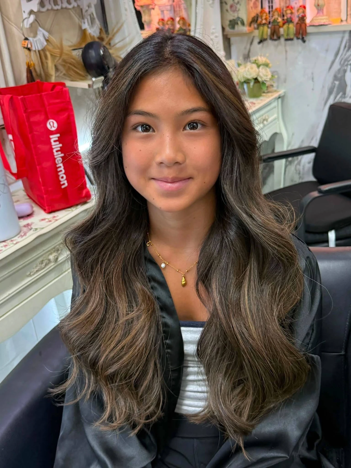 Front view of soft Brown Sugar Brunette Balayage with face-framing brightness in Bangkok