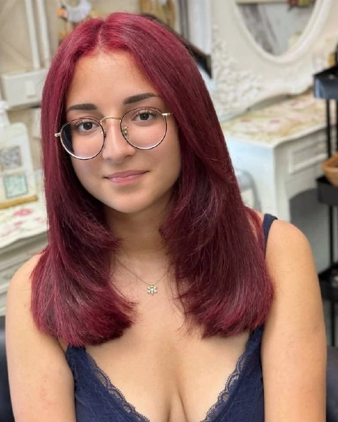 Front view of cherry red blonde hair color without bleach at Oilly Hair Salon Bangkok