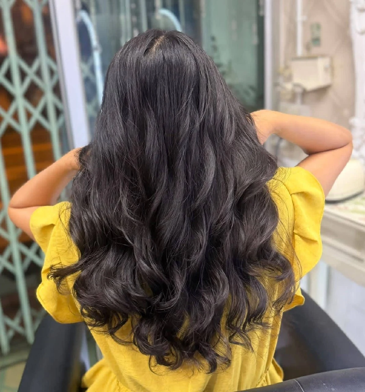 After large S-wave digital perm at Oilly Hair Salon Bangkok, heavy long hair with layered volume and natural waves