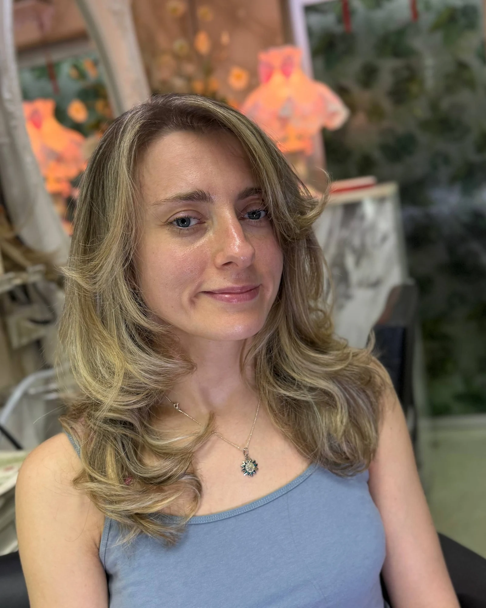 Front view of fine blonde highlights adding brighter dimension around the face at Oilly Hair Salon Bangkok