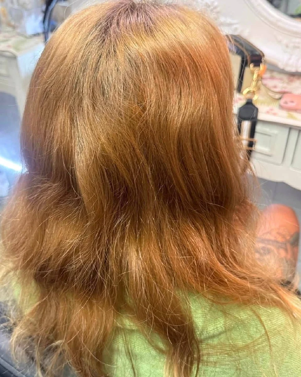 Warm uneven blonde-brown hair before Balayage color correction in Bangkok