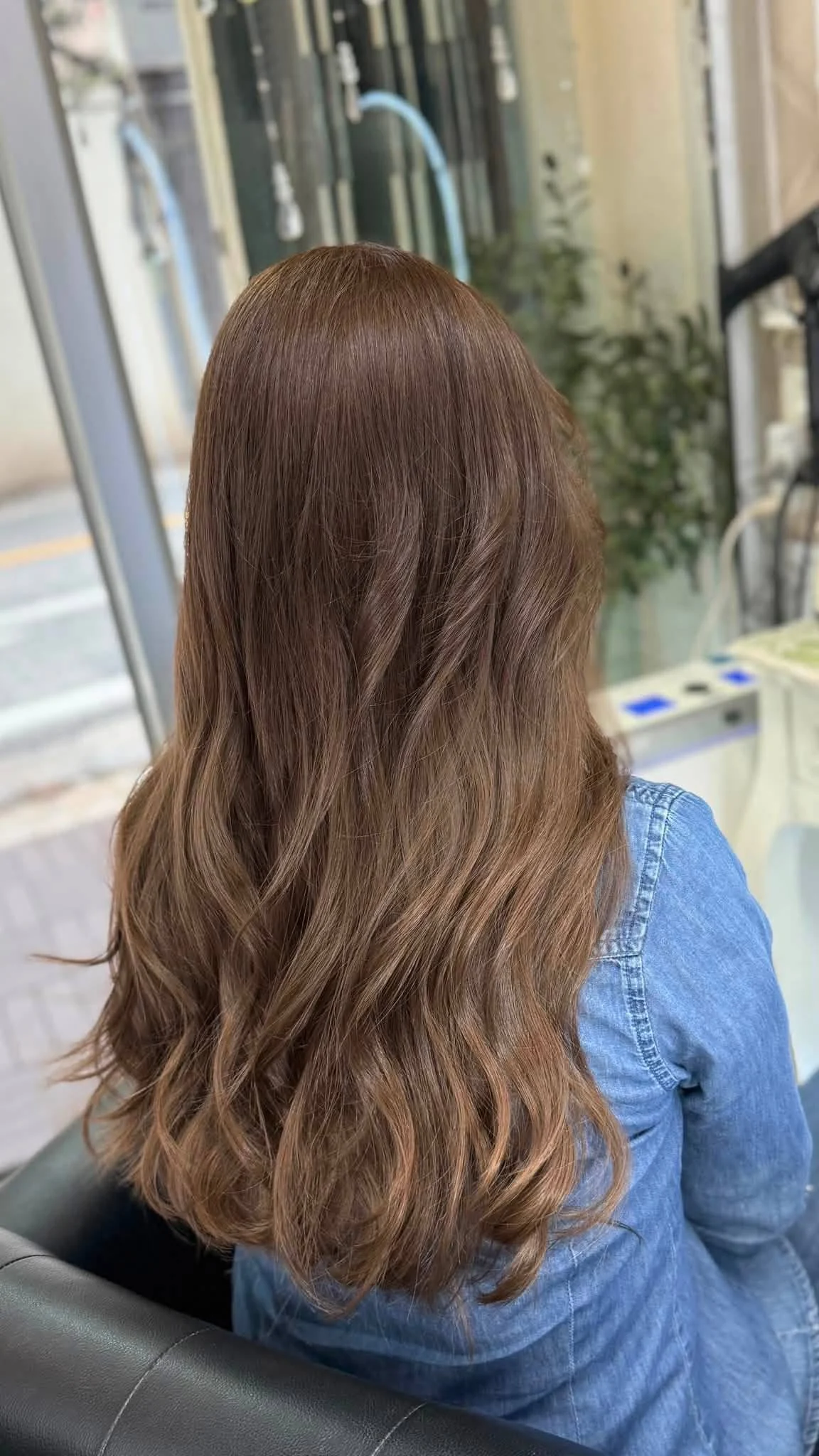 Back view of soft no-bleach brunette ombre with natural dimension on European hair