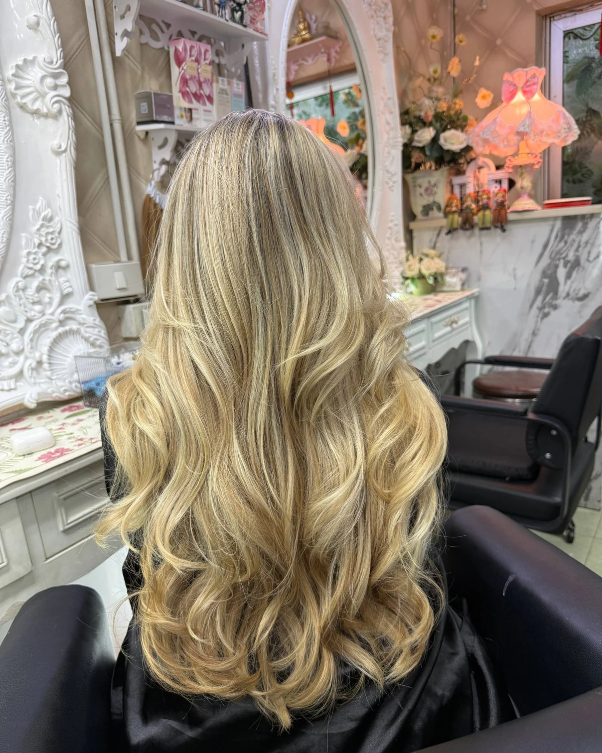Back view of fine off-root Baby Highlights diffused through blonde hair for natural grey blending in Bangkok