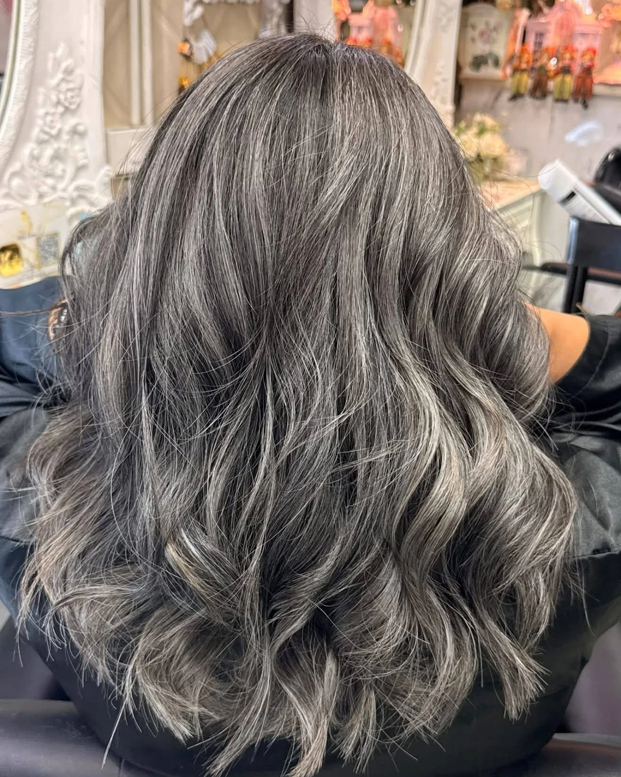 Soft silver baby highlights blended with natural grey hair at Oilly Hair Salon Bangkok