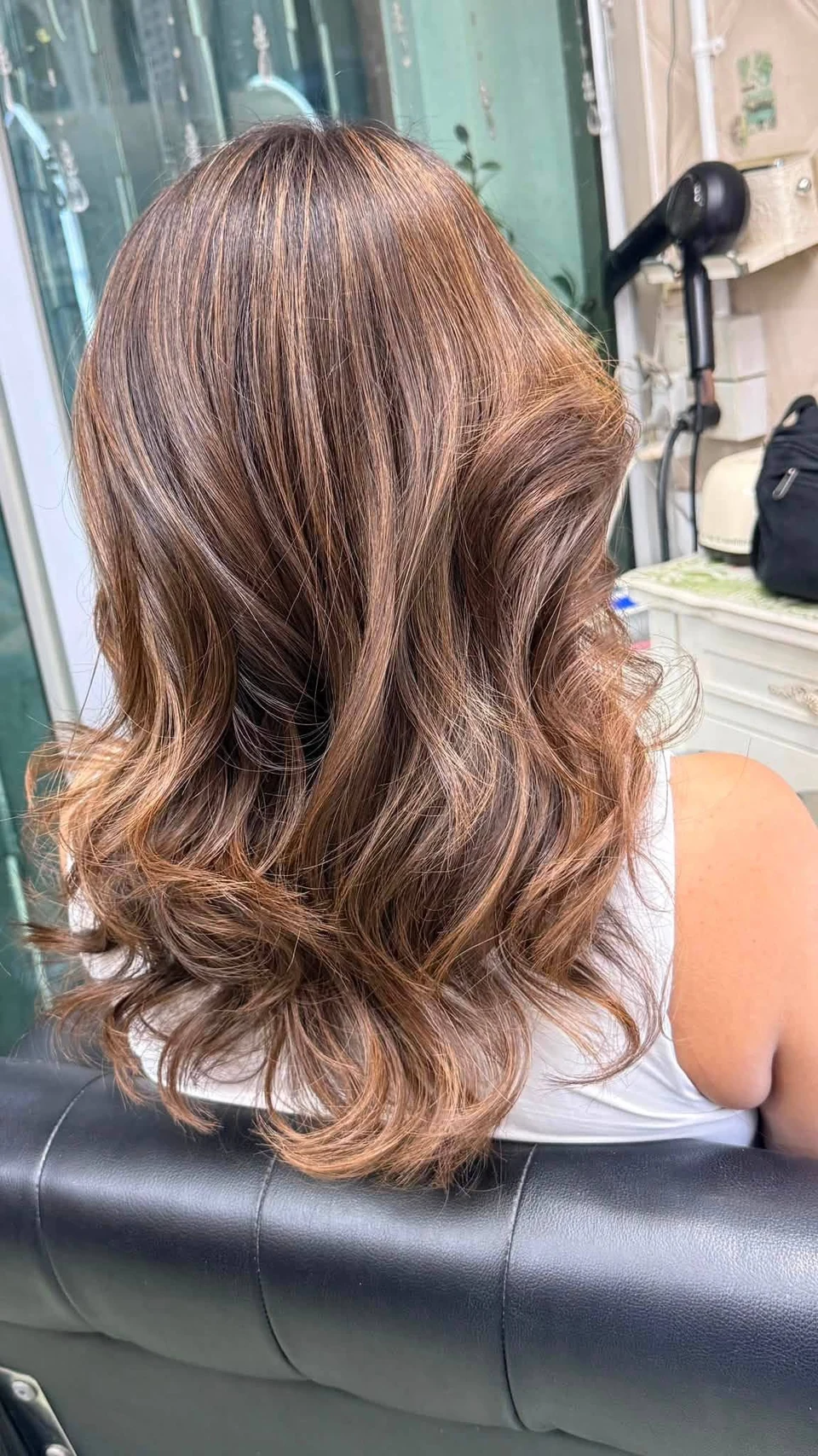 Warm honey brown Balayage and glossy straight lengths after keratin in Bangkok