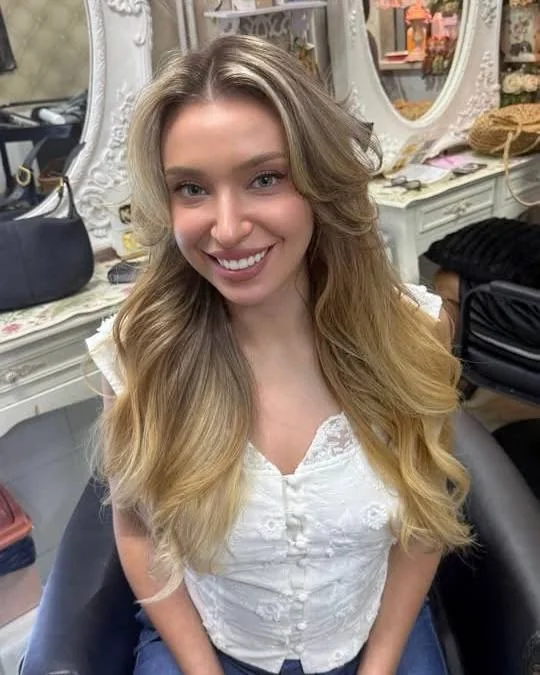Front result of Honey Beige Blonde AirTouch Balayage on long dark-dyed hair at Oilly Hair Salon Bangkok