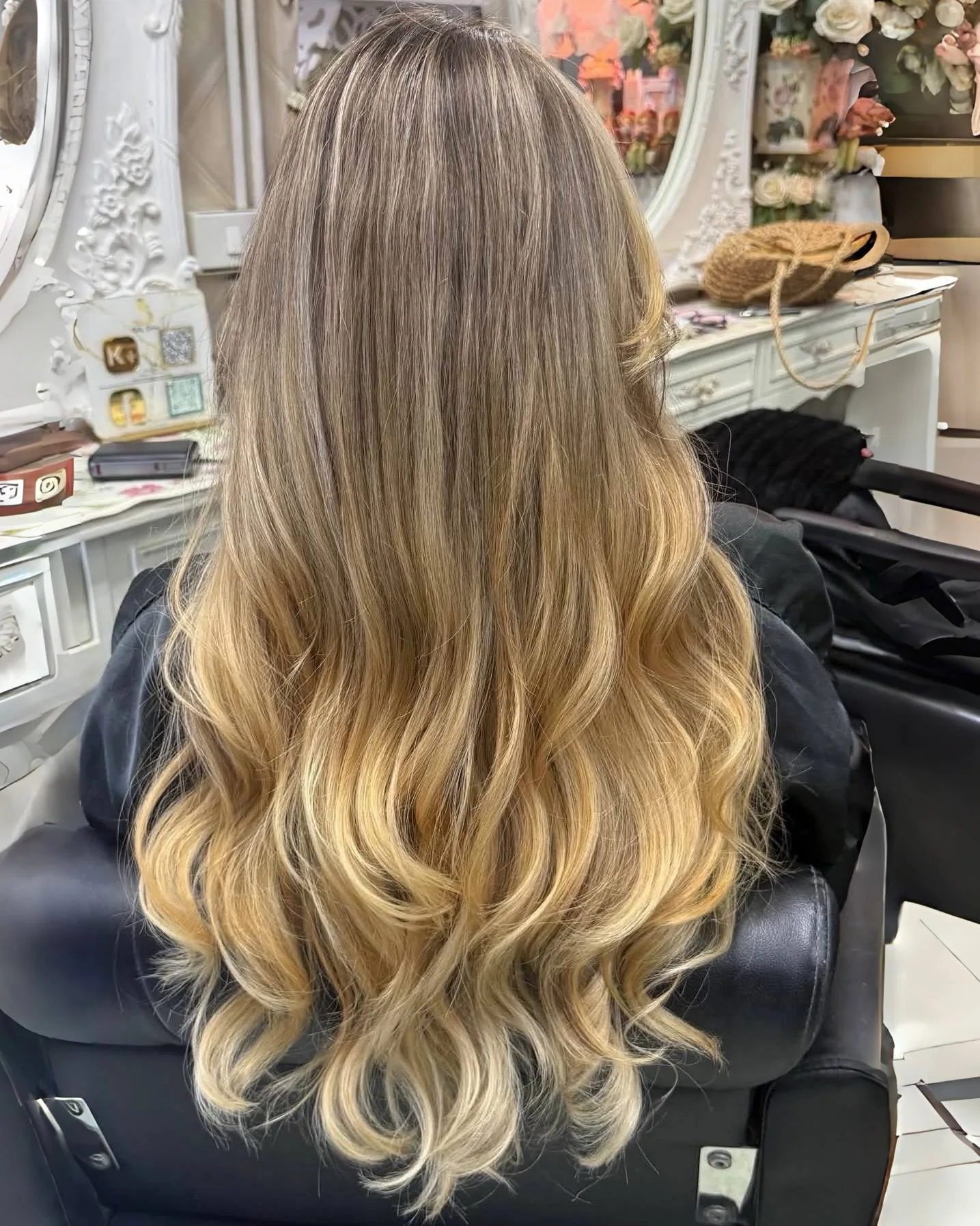 Back view after Honey Beige Blonde AirTouch Balayage on long dark-dyed hair at Oilly Hair Salon Bangkok