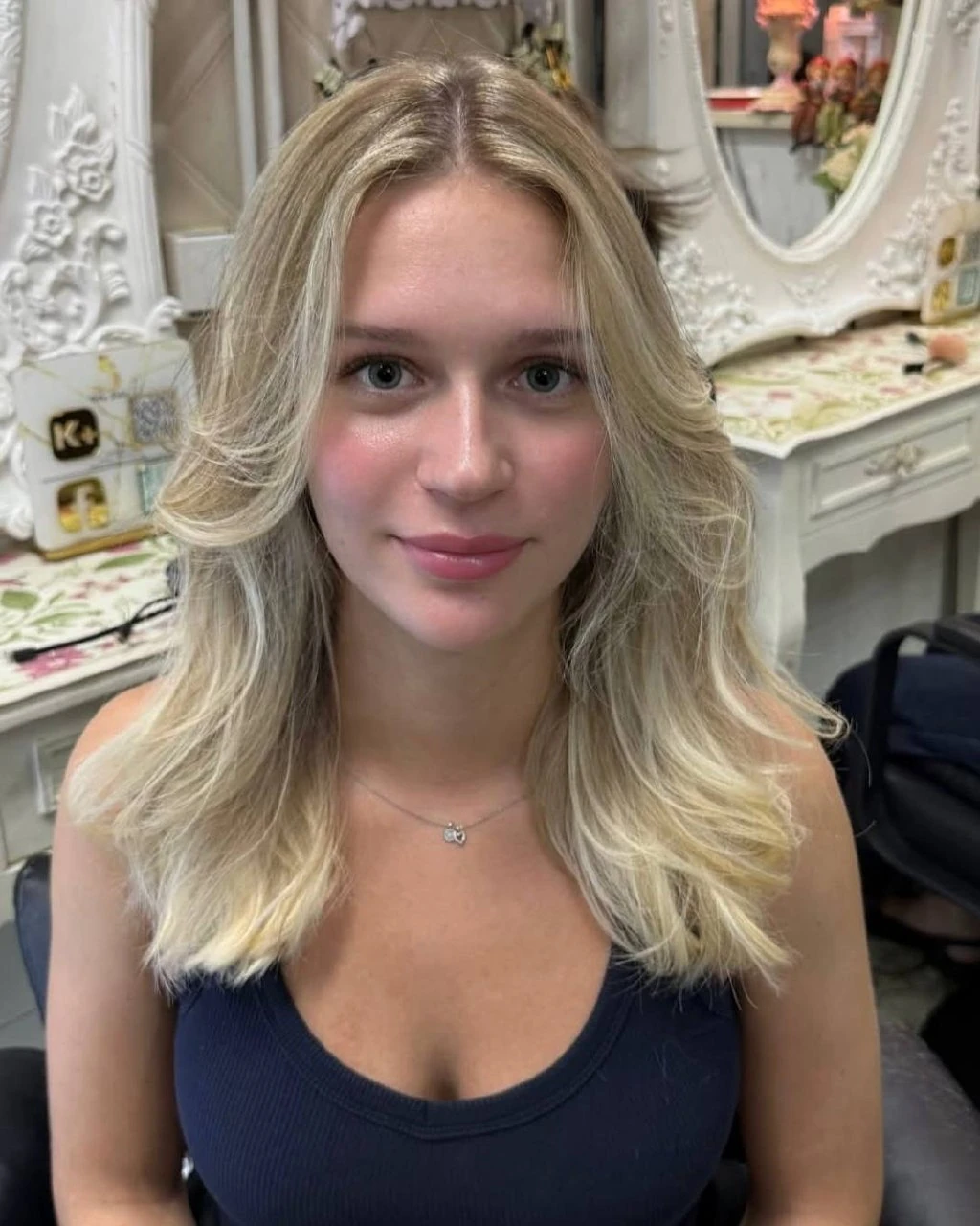 Finished face-framing beige blonde Balayage and layered haircut at Oilly Hair Salon Bangkok