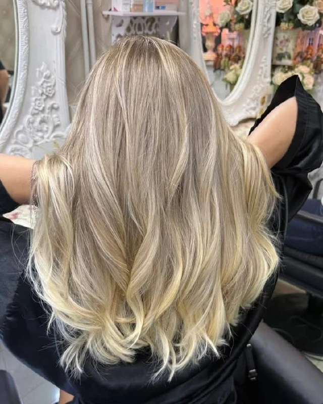 Back view of champagne beige blonde Balayage and AirTouch with fine ribbons at Oilly Hair Salon Bangkok
