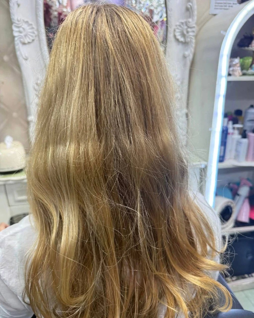 Long, frizzy blonde hair with little shape before a cold perm in Bangkok