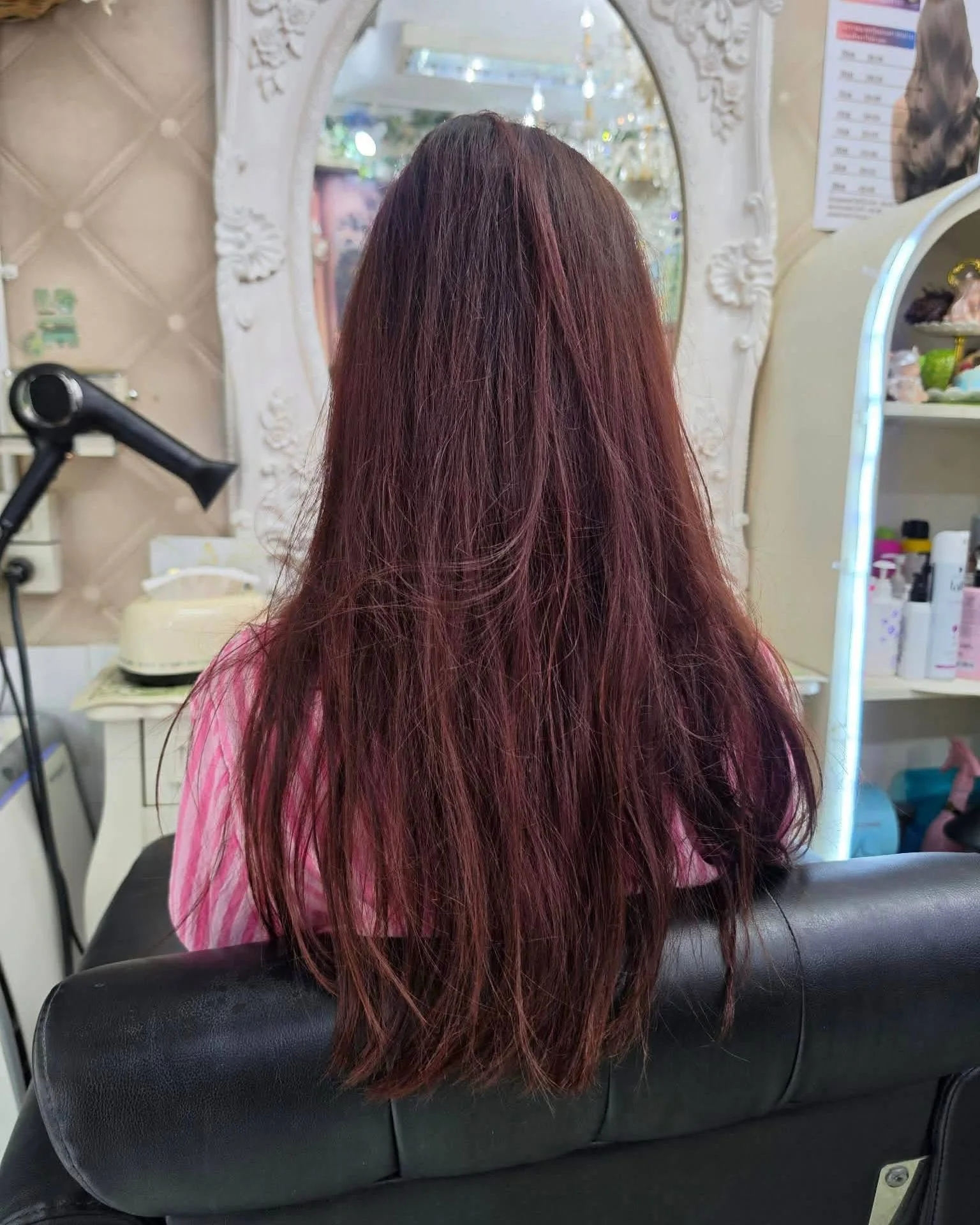 Back view of long brown hair before a full-head bleach to Dusty Rose Pink in Bangkok