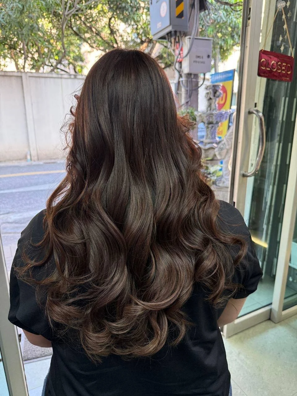Long no-bleach brown Balayage with soft natural-root dimension at Oilly Hair Salon Bangkok